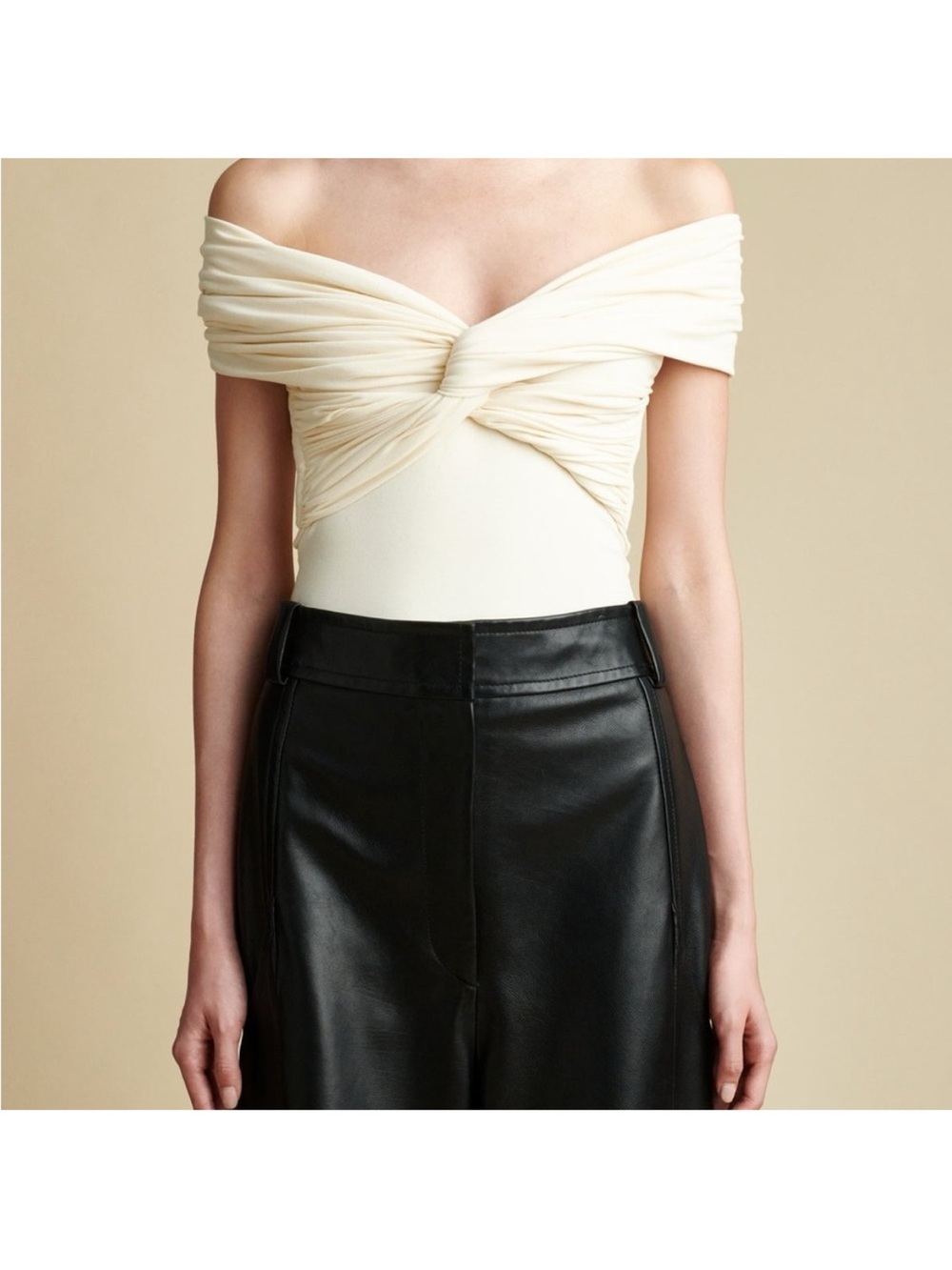 KHAITE Off-Shoulder Twist Bodysuit in Cream